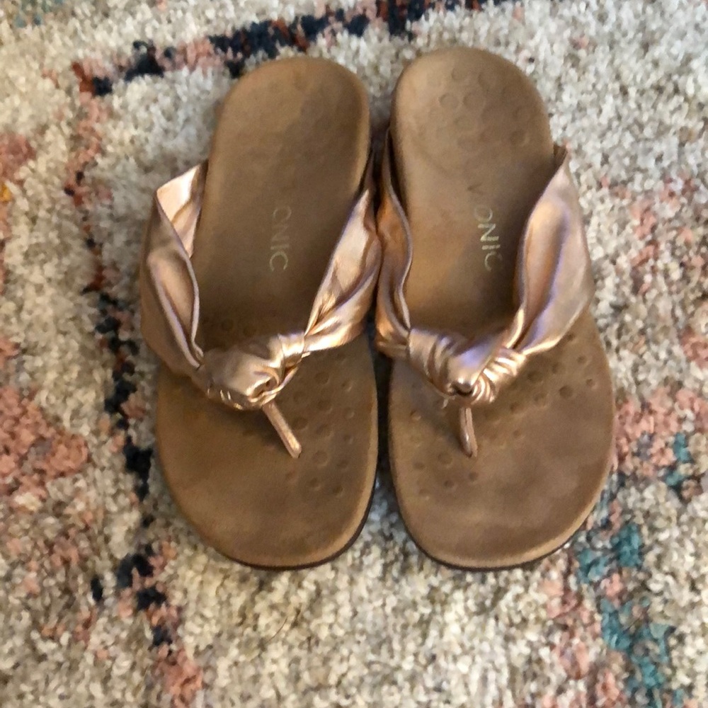 Front knot rose gold sandals.